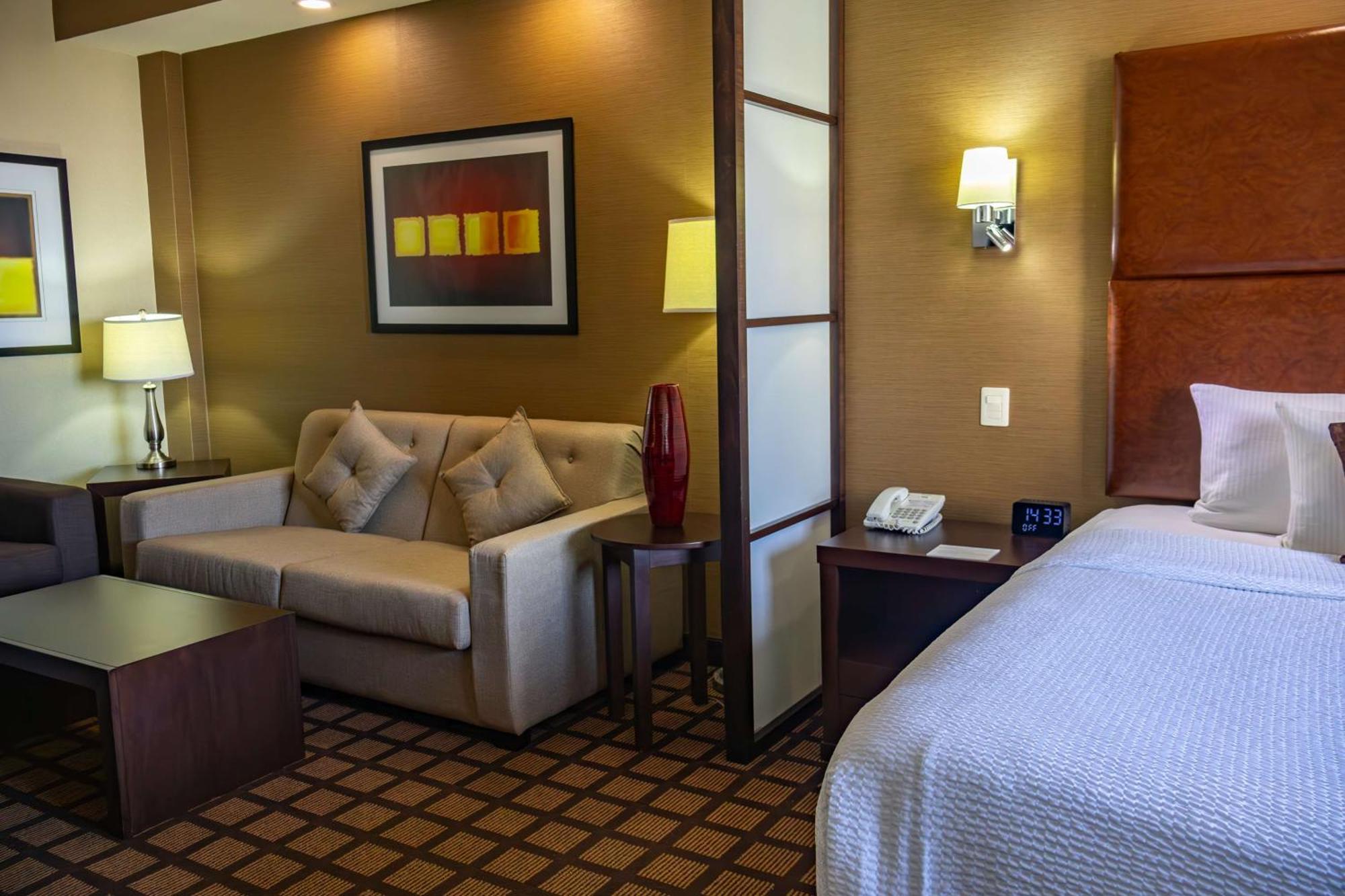 Best Western Premier Monterrey Aeropuerto Аподака Экстерьер фото A typical hotel room at the Residence Inn